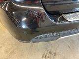 a close up of a car ' s bumper with a sticker on it