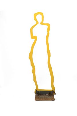 statue of a woman in a yellow dress on a wooden base