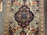 an image of a rug on the floor with a chair in the background