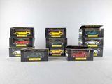 six different models of cars in boxes on a white surface