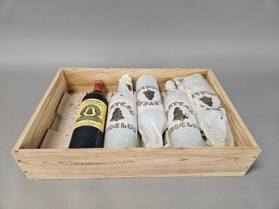 a wooden box with a bottle of wine and a bottle of wine in it