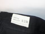 the label on the back of a pair of black jeans