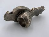 an image of a metal object on a white surface
