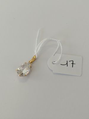 a close up of a small crystal pendant on a string with a price tag
