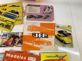 a lot of old model cars on display on the table