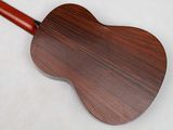 an image of a wooden guitar on a white surface