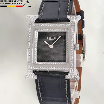 an image of a close up of a wrist watch with diamonds on it