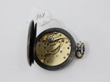a close up of a pocket watch with a tag attached to it