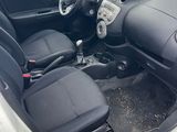 the interior of a car with the door open and the seats down