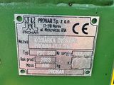 a close up of a green machine with a label on it
