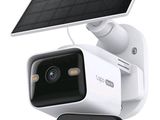 a solar powered security camera attached to a wall
