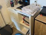 a desk with a laptop and a monitor on it