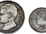 a close up of a coin with a man ' s face on it