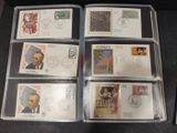 several different stamps are in a clear box on a table