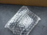 a bag of plastic wrap sitting on the floor