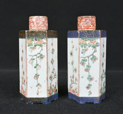 pair of chinese porcelain vases with flowers and birds on them