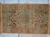 an old rug on a tile floor with a white tile floor