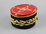 a red and black box with a gold design on it