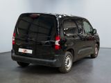 a black van that is parked in a room