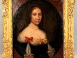 portrait of a lady in a black dress with a red bow