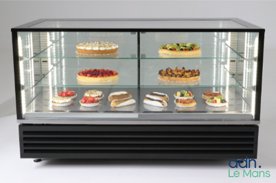 a display case with many different types of cakes in it