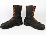 pair of black leather boots with brown laces on a white background