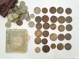 a lot of coins and a wallet on the table