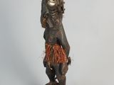 an image of a statue of a man with a beard on a wooden base