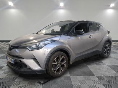 the toyota c - hr suv is parked on a checkered floor