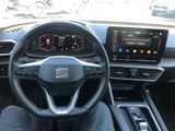 the interior of a car with a steering wheel and a dash board