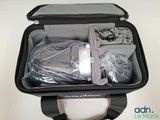 an open suitcase with items in it sitting on a table