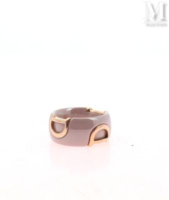a close up of a ring on a white surface with a white background