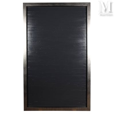 the blackboard is hanging on the wall in front of a white wall