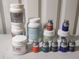 many different types of skin care products sitting on a table