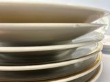 several plates stacked on top of each other on a table