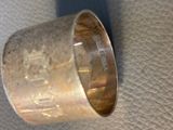 a close up of a silver cup on a table