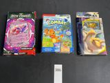 three pokemon trading cards are sitting on a table next to each other