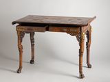 an old wooden desk with a drawer on top of it
