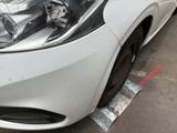 a close up of a car ' s headlight on the side of the road