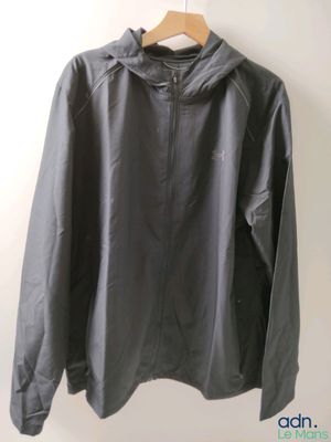 an image of a black jacket hanging on a hanger