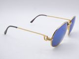 a pair of sunglasses with gold frames and blue lenses