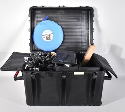 a black case with a blue frisbee inside of it