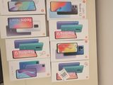 many boxes of cell phones sitting on a shelf