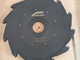 a circular saw blade on a table next to a tool