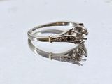 sterling silver ring with a flower and leaves design on the side