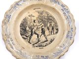 a plate with a picture of a man holding a baseball bat