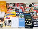 a lot of books that are sitting on a table