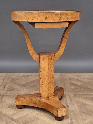 an image of a wooden table on a parquet floor