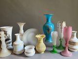 many vases that are sitting on a table
