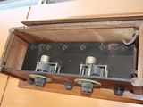 a wooden box with a bunch of electrical equipment inside of it